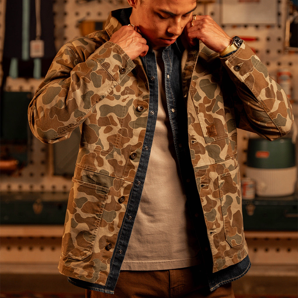 Man wearing a "Duck Camo" Utility Jacket