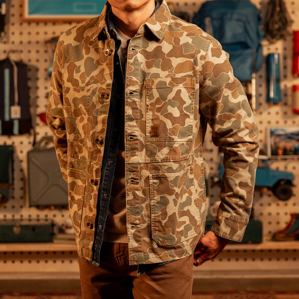 Man wearing a "Duck Camo" Utility Jacket