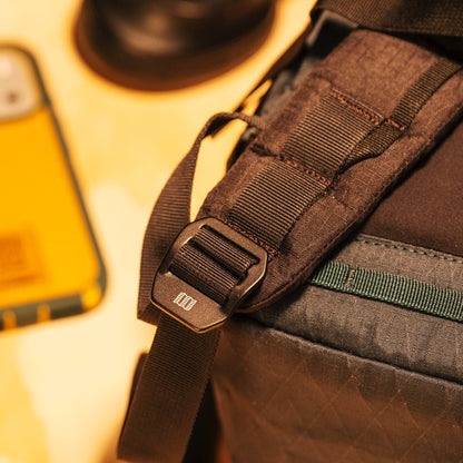 General lifestyle shot of Topo Designs Global Pro Backpack showing strap hardware