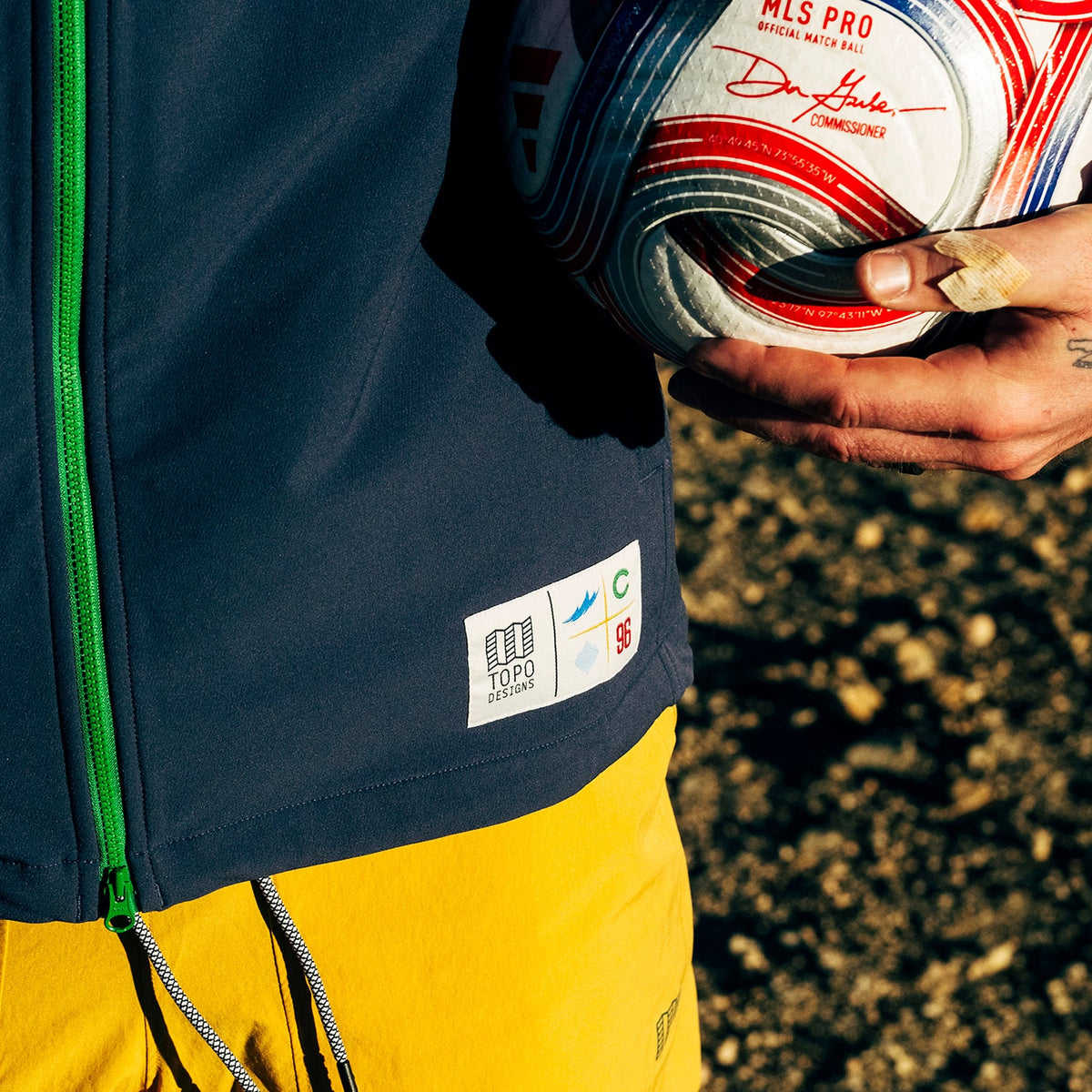 General lifestyle shot of Topo Designs x Colorado Rapids HighPeak Jacket