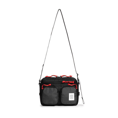 Front view of Topo Designs Block Bag in "Black / White Grid"
