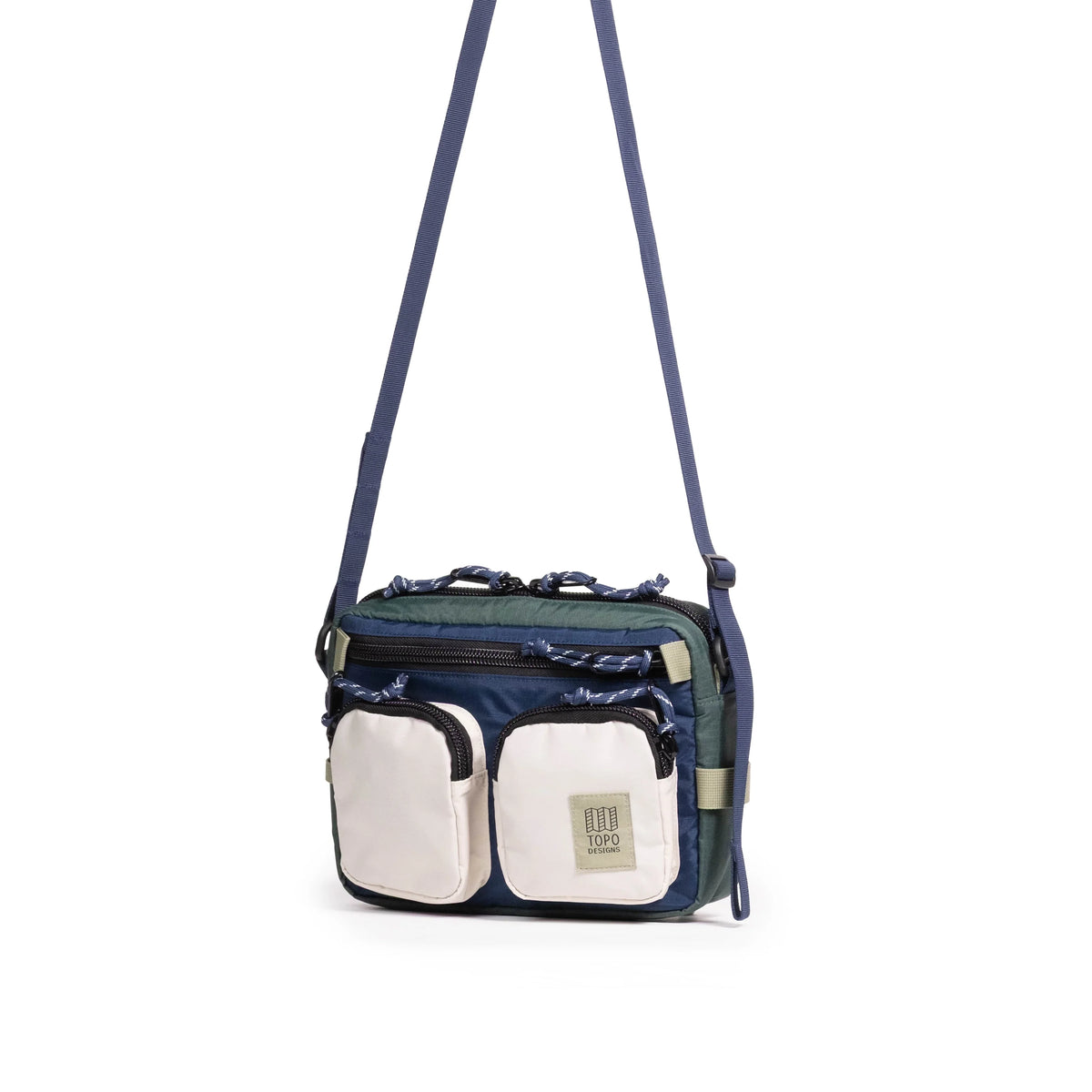Front quarter view of Topo Designs Block Bag in "Forest / Bone White"