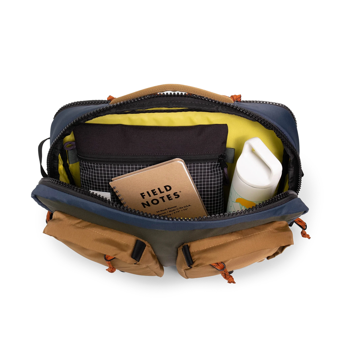 General detail product shot of the global briefcase in "Olive / Dark Khaki" showing the main compartment.