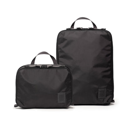 Front white background image of Topo Designs Global Compression Pack Bag Set in "Black / Black"