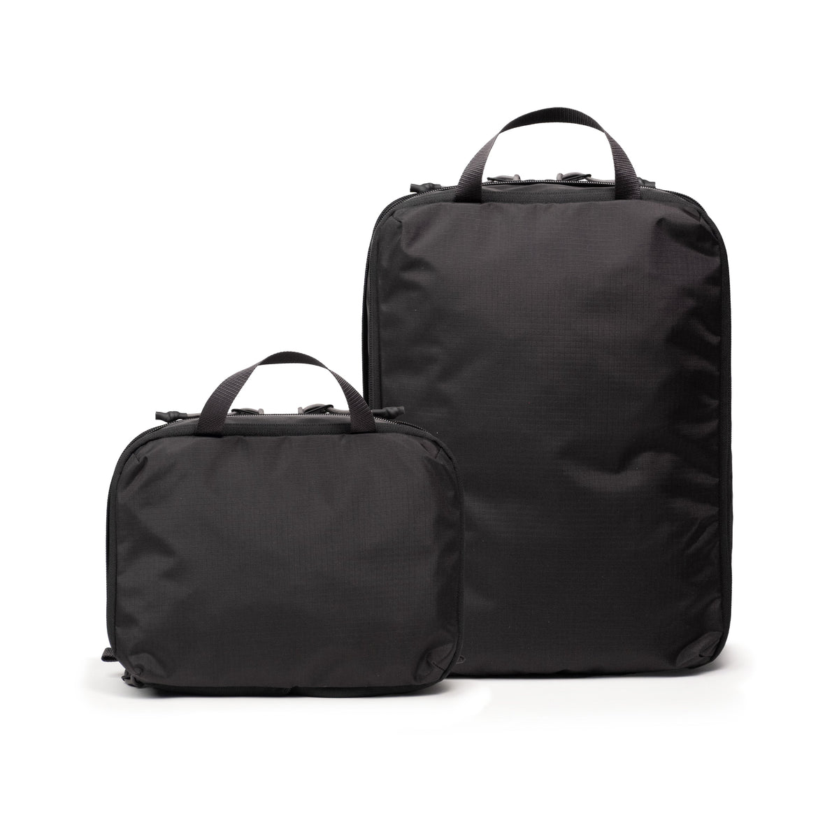 Back white background image of Topo Designs Global Compression Pack Bag Set in "Black / Black"