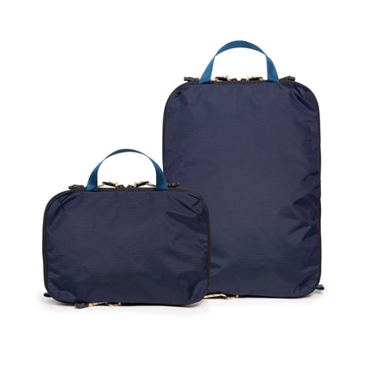 Back white background image of Topo Designs Global Compression Pack Bag Set in "Navy / Sahara"