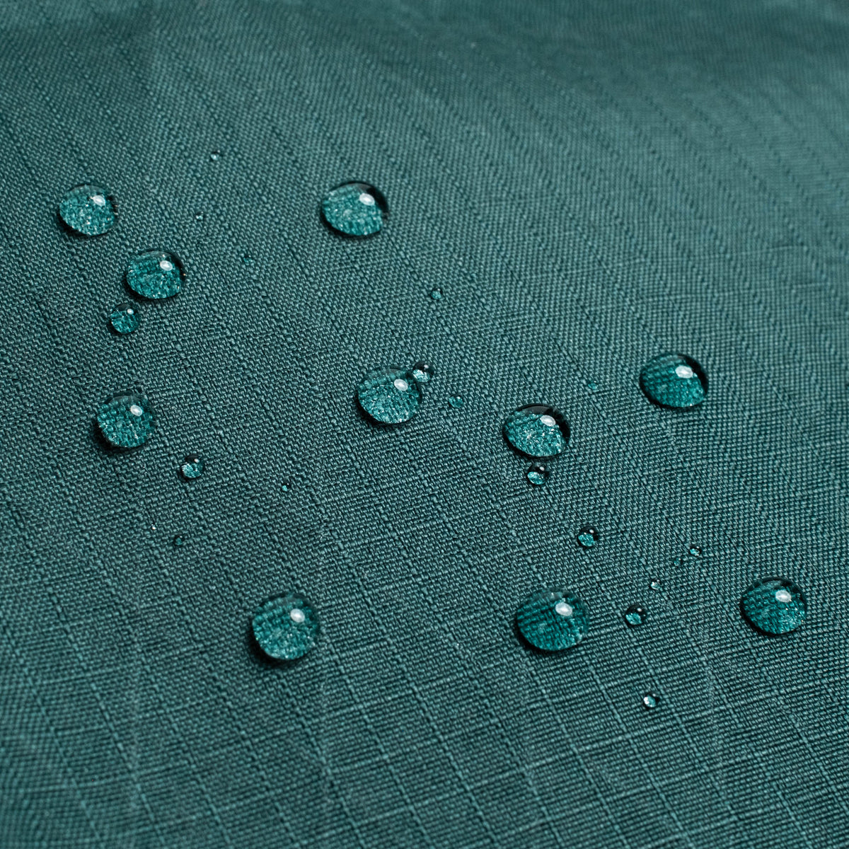 General shot of Topo Designs Global Pro Backpack showing detail shot of water droplets on waterproof material
