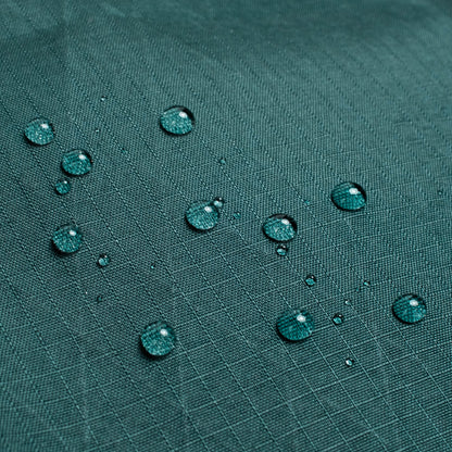 General back shot of Topo Designs Global Pro Travel Roller Bag showing water droplets on waterpoof material