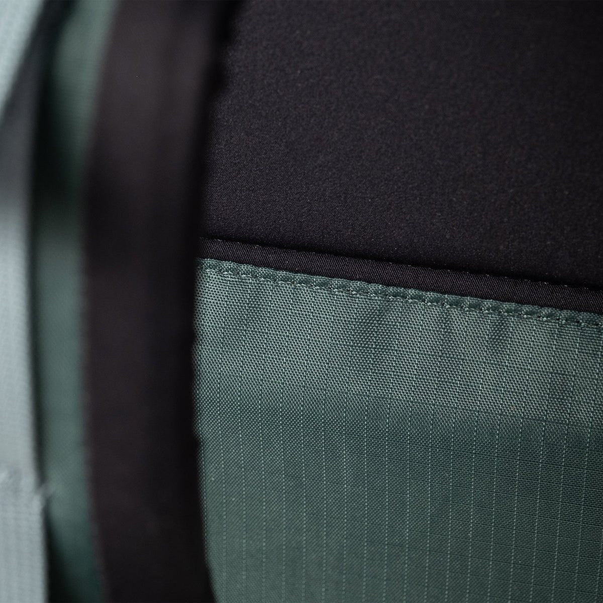 General Detail shot of Topo Designs Global Travel Backpack in "Stone Blue / Forest"