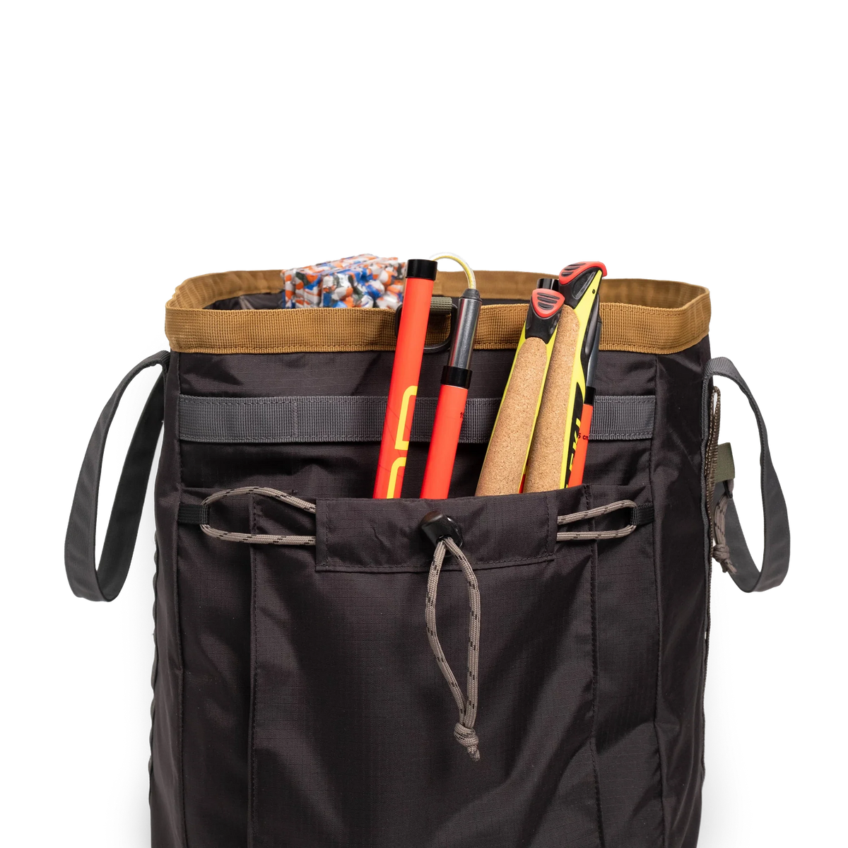 General detail shot of Topo Designs Mountain Gear Bag in "Black / Neutral" with side pocket packed out.