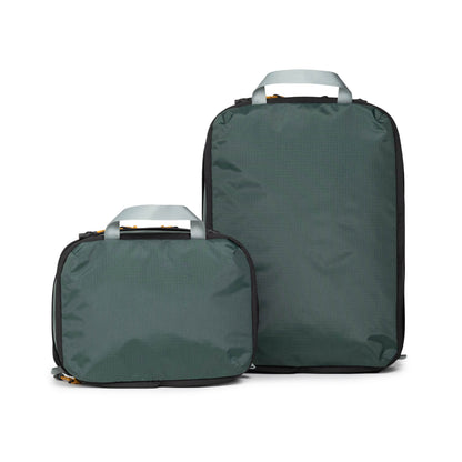 Back white background image of Topo Designs Global Compression Pack Bag Set in "Stone Blue / Forest"