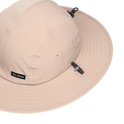 General detail shot of Topo Designs Sun Hat with original logo patch in "Cobblestone".