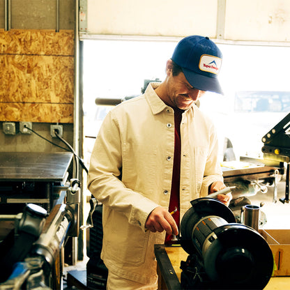 General lifestyle image of Patch Mesh Trucker - Retro Icon hat in "French Blue"